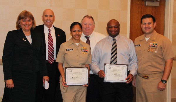 Teresa Duvall (l), chapter president, recognizes November award recipients Lt. j.g. Taysha Colon, USN, Military Cyber Professional, and Carlos Parker (2nd from r), Civilian Cyber Professional, while Walker (2nd from l), Alan Rickman and Lt. Cmdr. Dave Pereira, USN, chapter vice president of military affairs, stand witness.